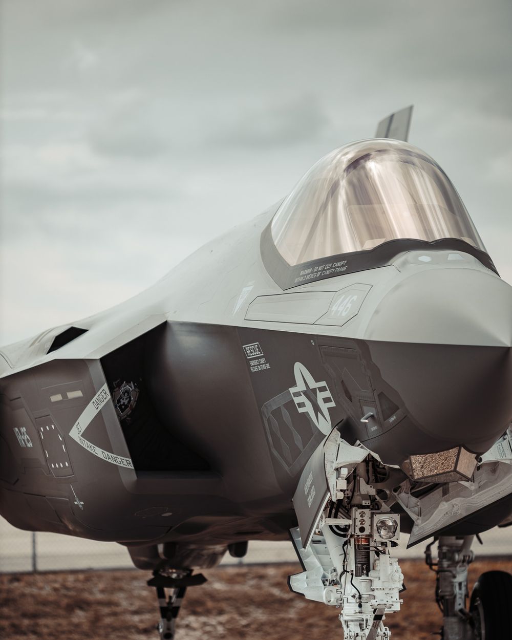 Close-up view of an F-35 fighter jet cockpit and nose section.