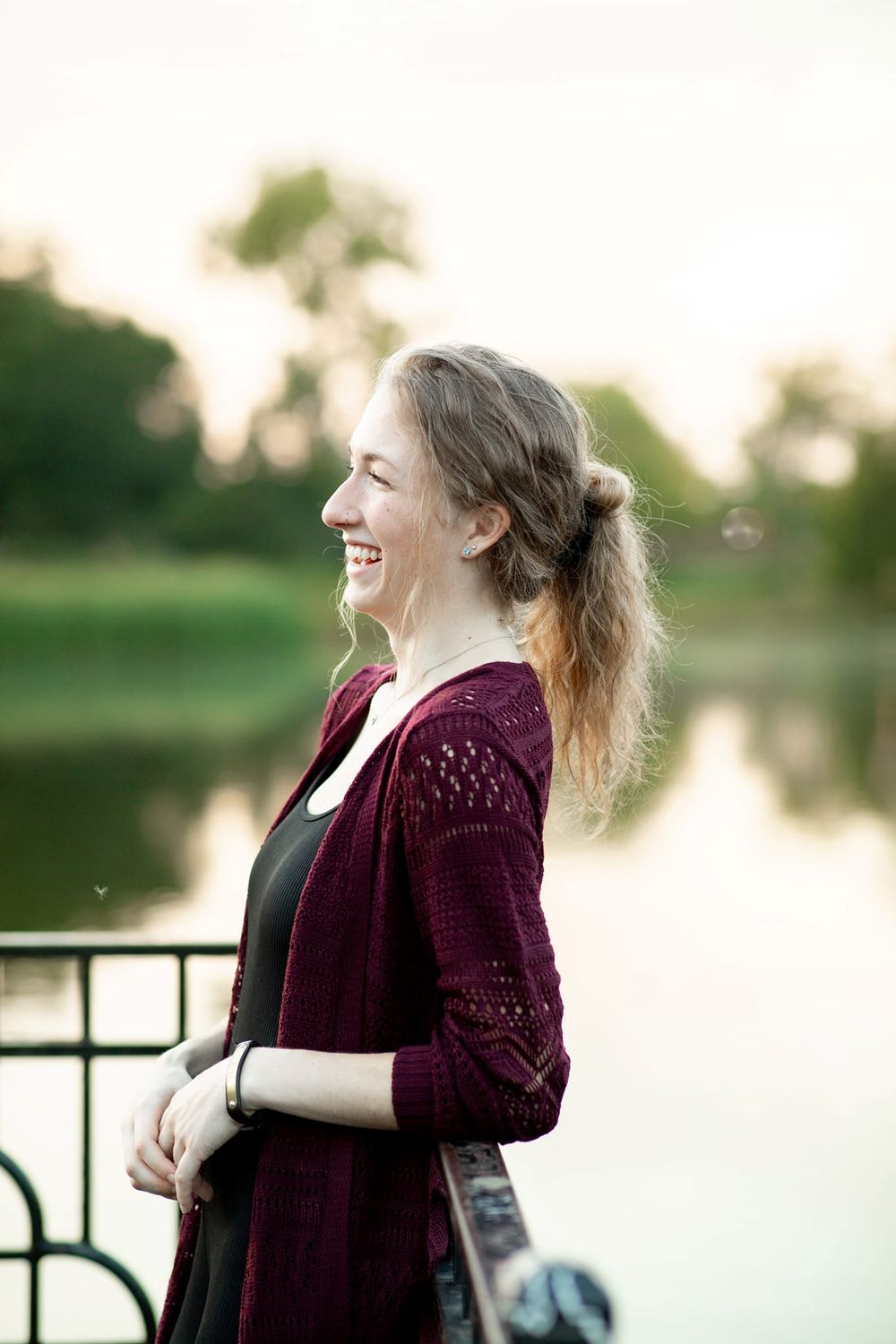 Portrait of a young woman, in profile view and laughing