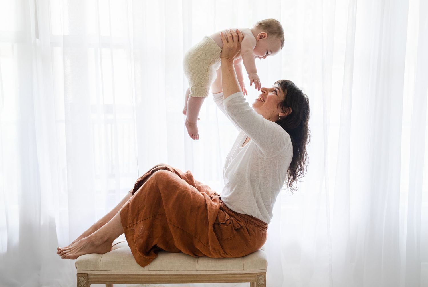 Charlottesville photographer, baby, milestone, family, newborn, mommy and me baby and mom against window on bench