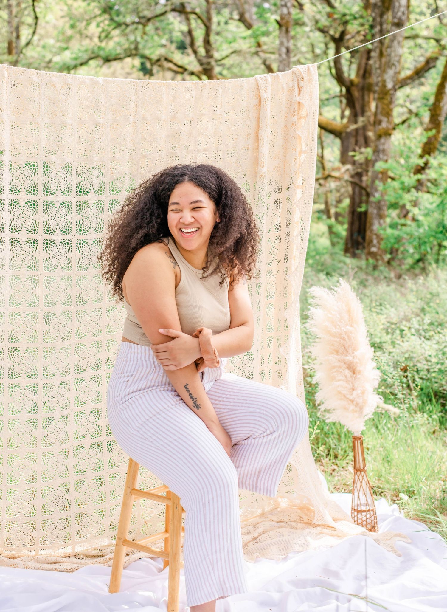 Whimsical outdoor session with bohemian styling and natural woodland backdrop.