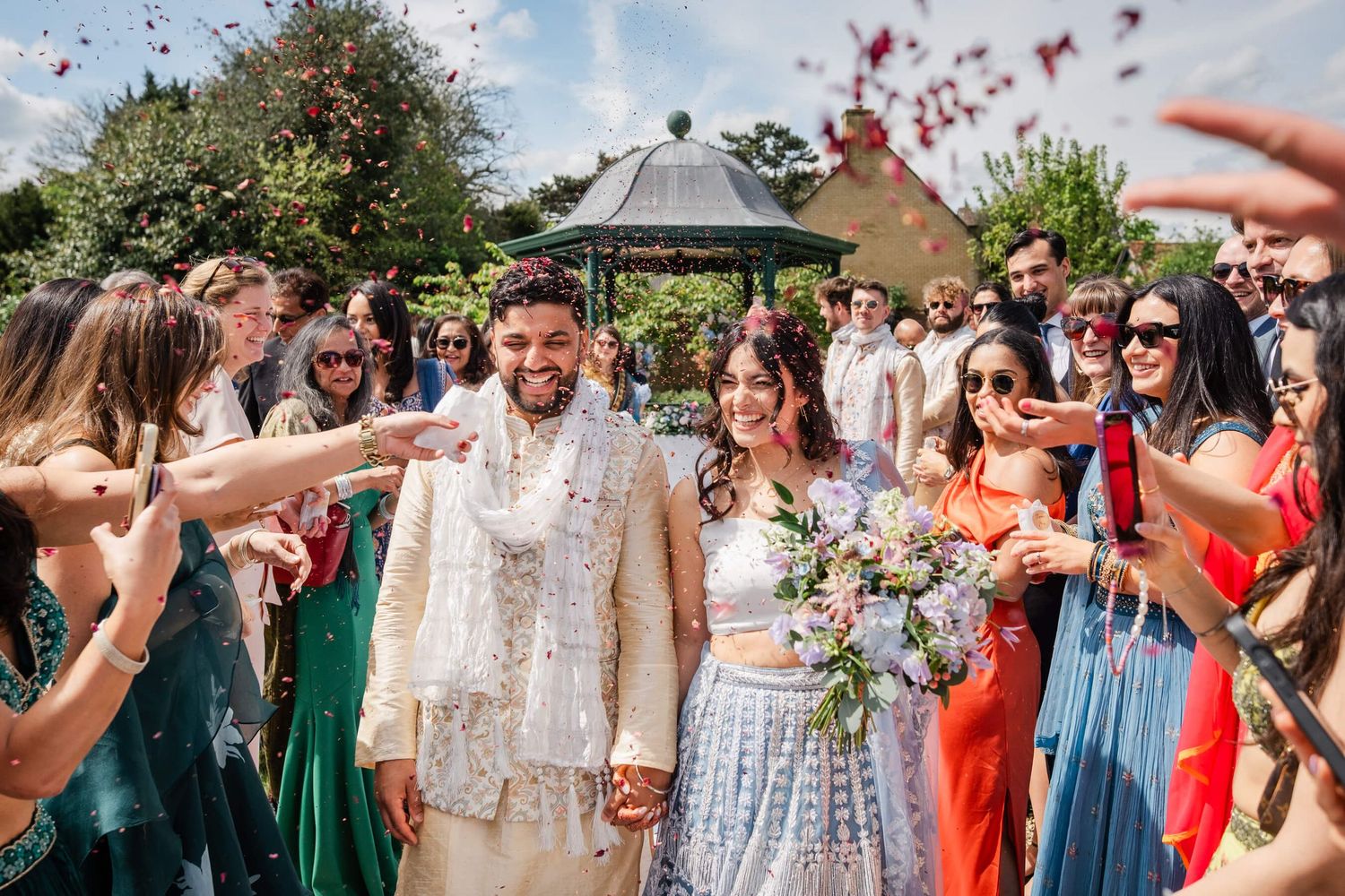 Affordable London Wedding Photographer taking a Candid confetti moment at a wedding