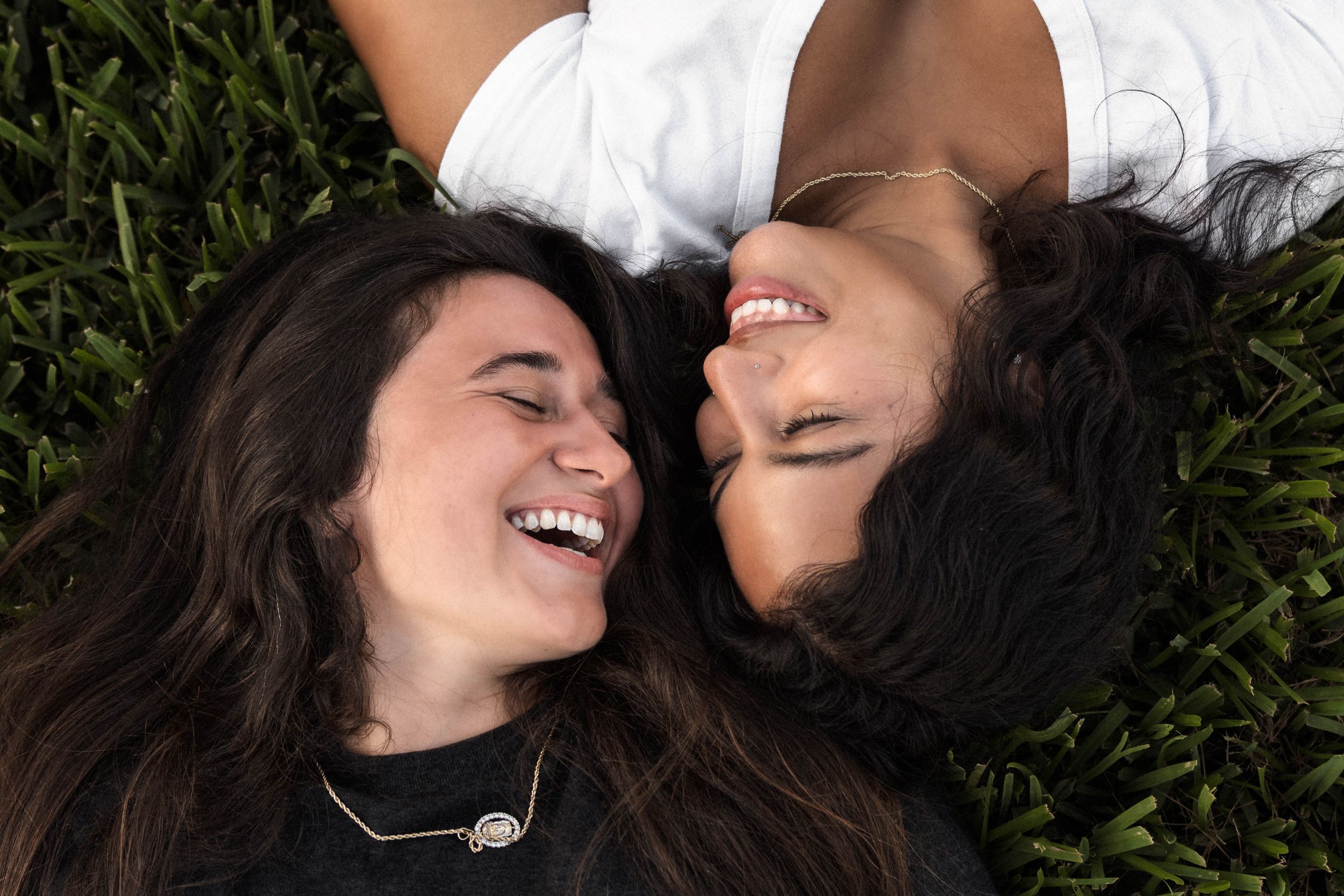 Lesbian couple portrait in Downtown Tampa, Florida by an LGBTQ+ friendly couples and engagement photographer.