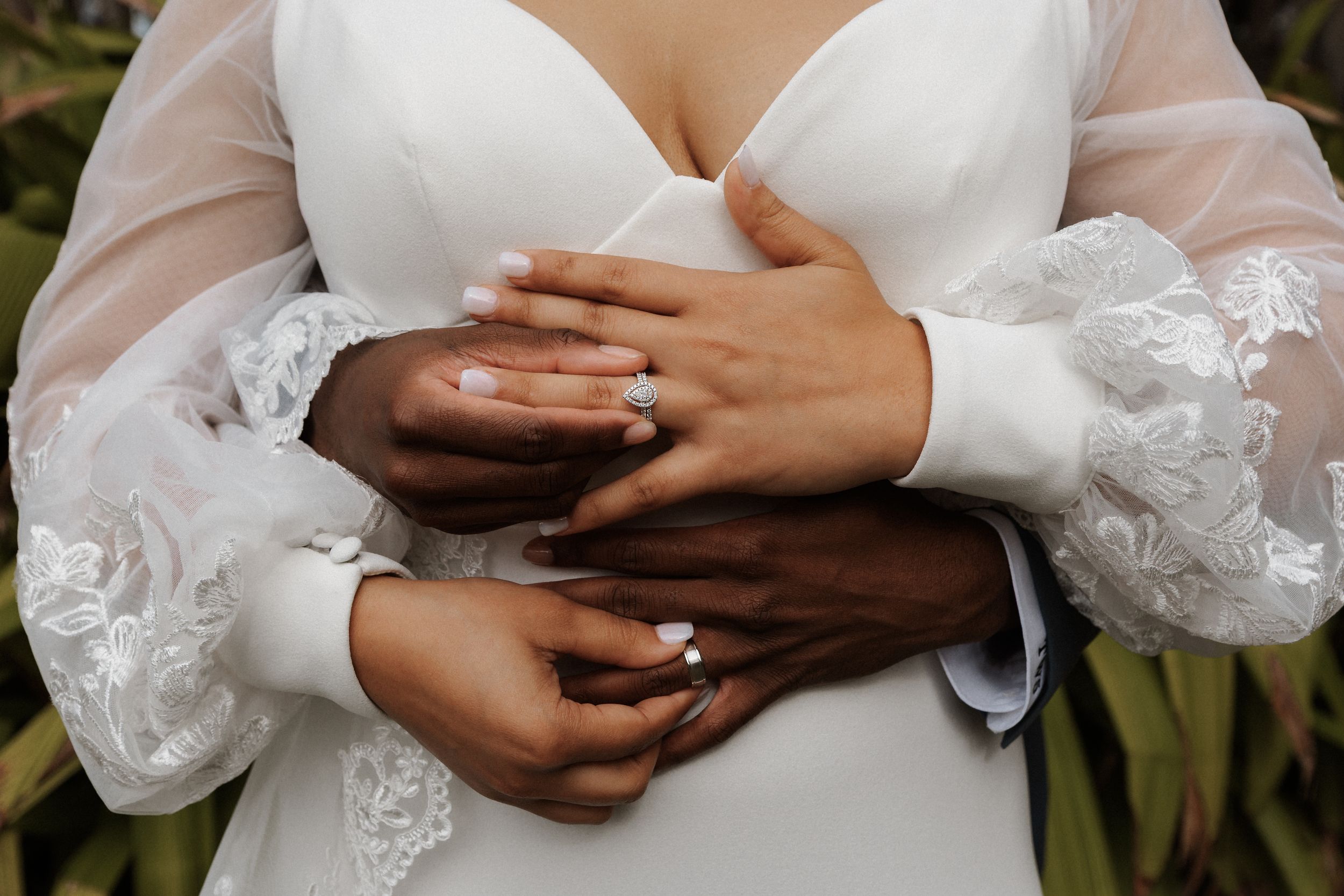 Wedding rings on bride and groom's hands during an Orlando, Florida wedding by a Central Florida wedding photographer.