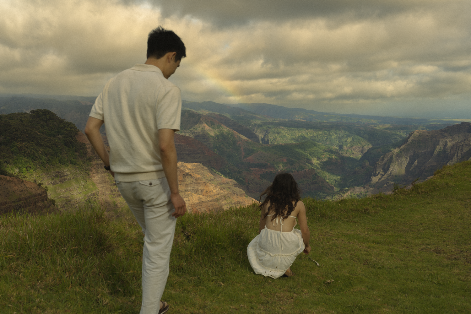 a couple picking flowers at the Grand Canyon look out kauai Hawaii