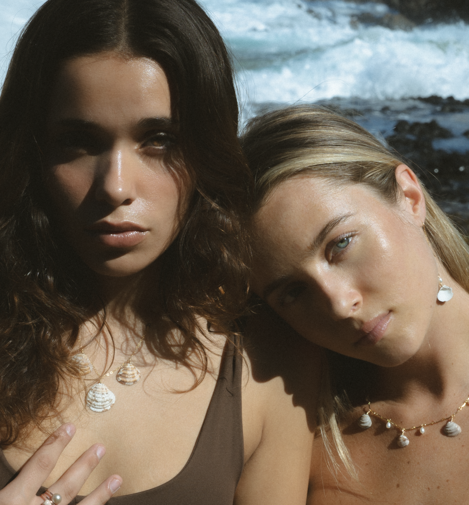 Elegant pearl jewelry and necklaces showcased in sunlit portrait style.
