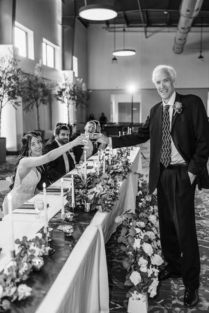 Bridal Party toast during reception at head table. Cincinnati Wedding photographer. NKY wedding photographer. Chicago Wedding Photographer.