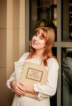 A series of artistic portraits showing someone posing with vintage books against a neutral indoor background.