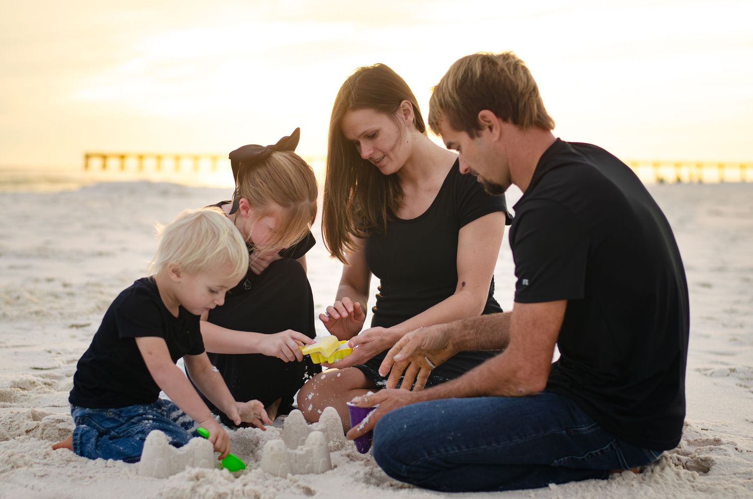playing in the sand perfect family. storytelling photographer and photography