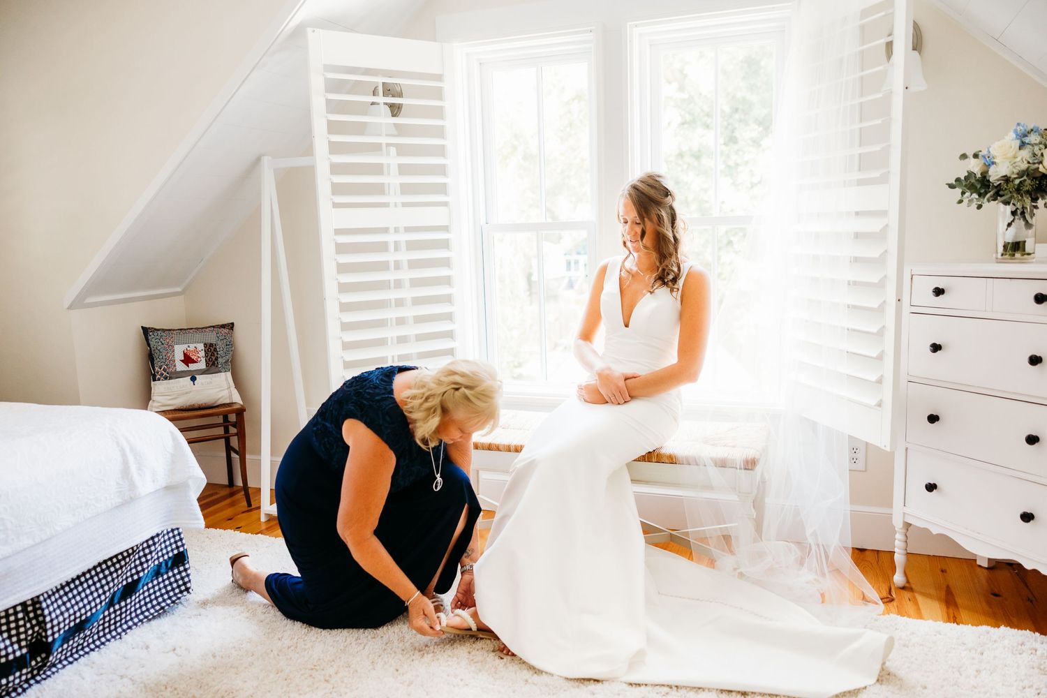 A series of bright white nursery photos showing furniture, decor and someone arranging items in a modern minimalist style.