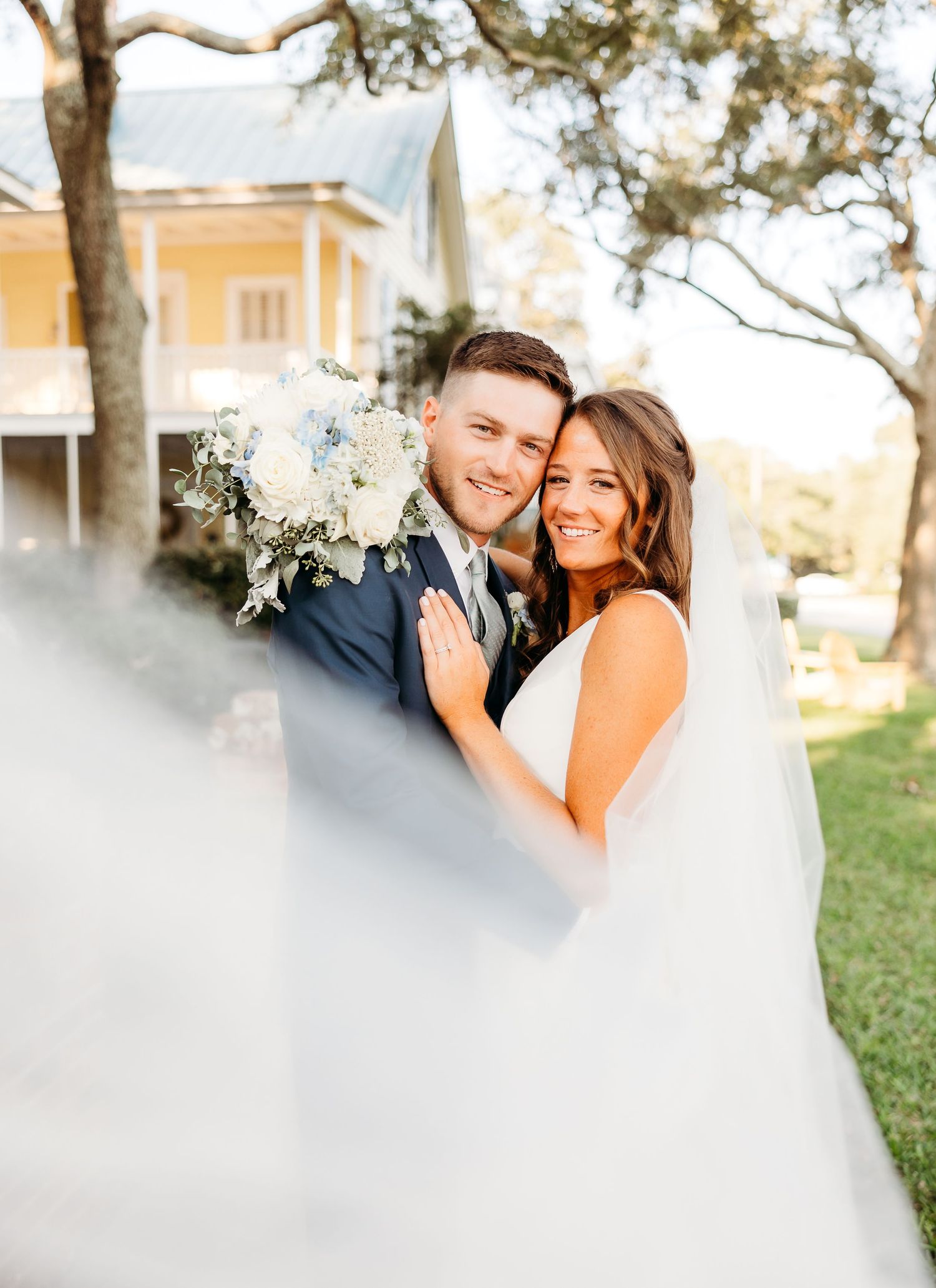 A couple shares intimate moments in a romantic outdoor photo session with soft lighting and dreamy effects.