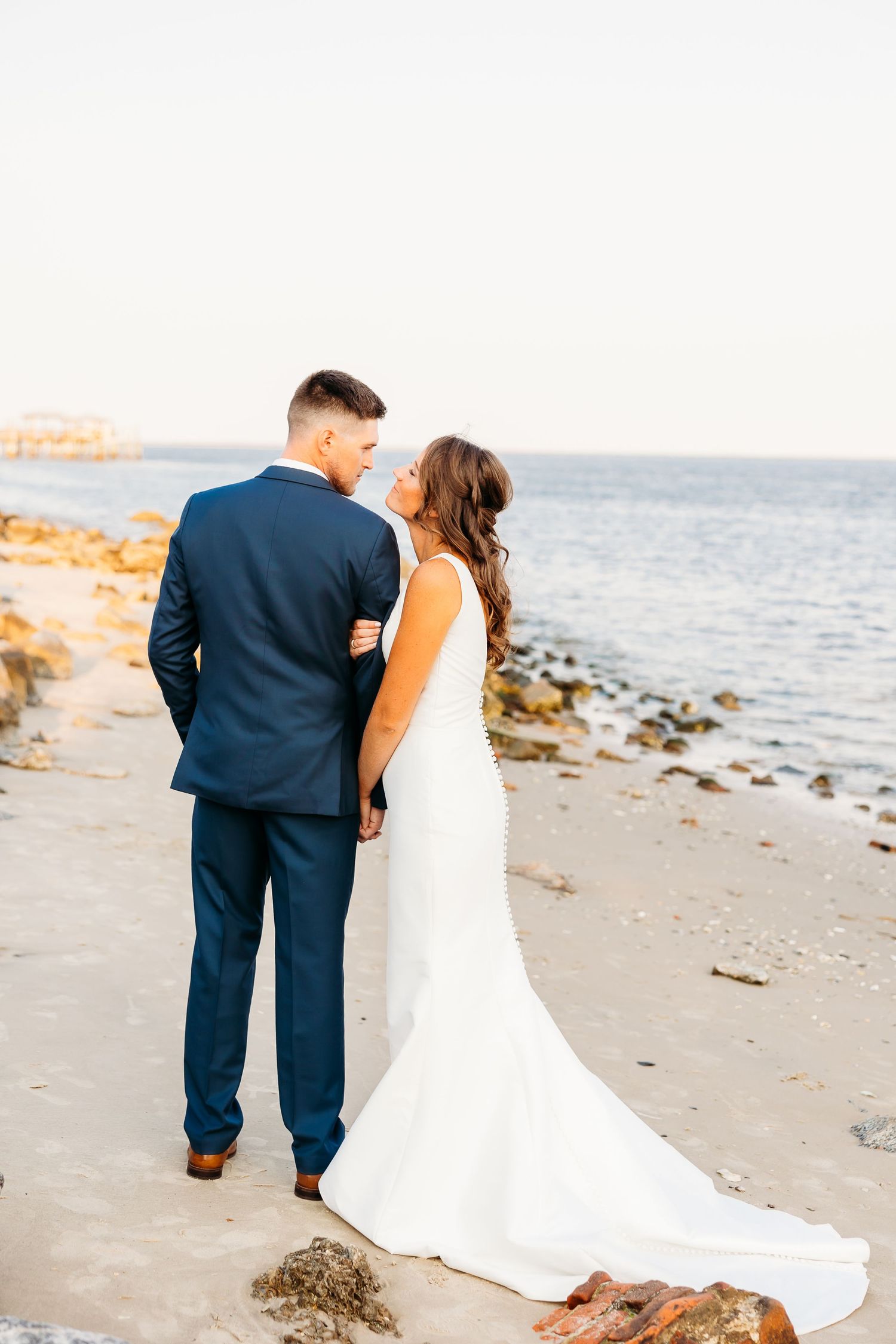 A romantic beach wedding photo sequence shows a couple walking along the shore at sunset.
