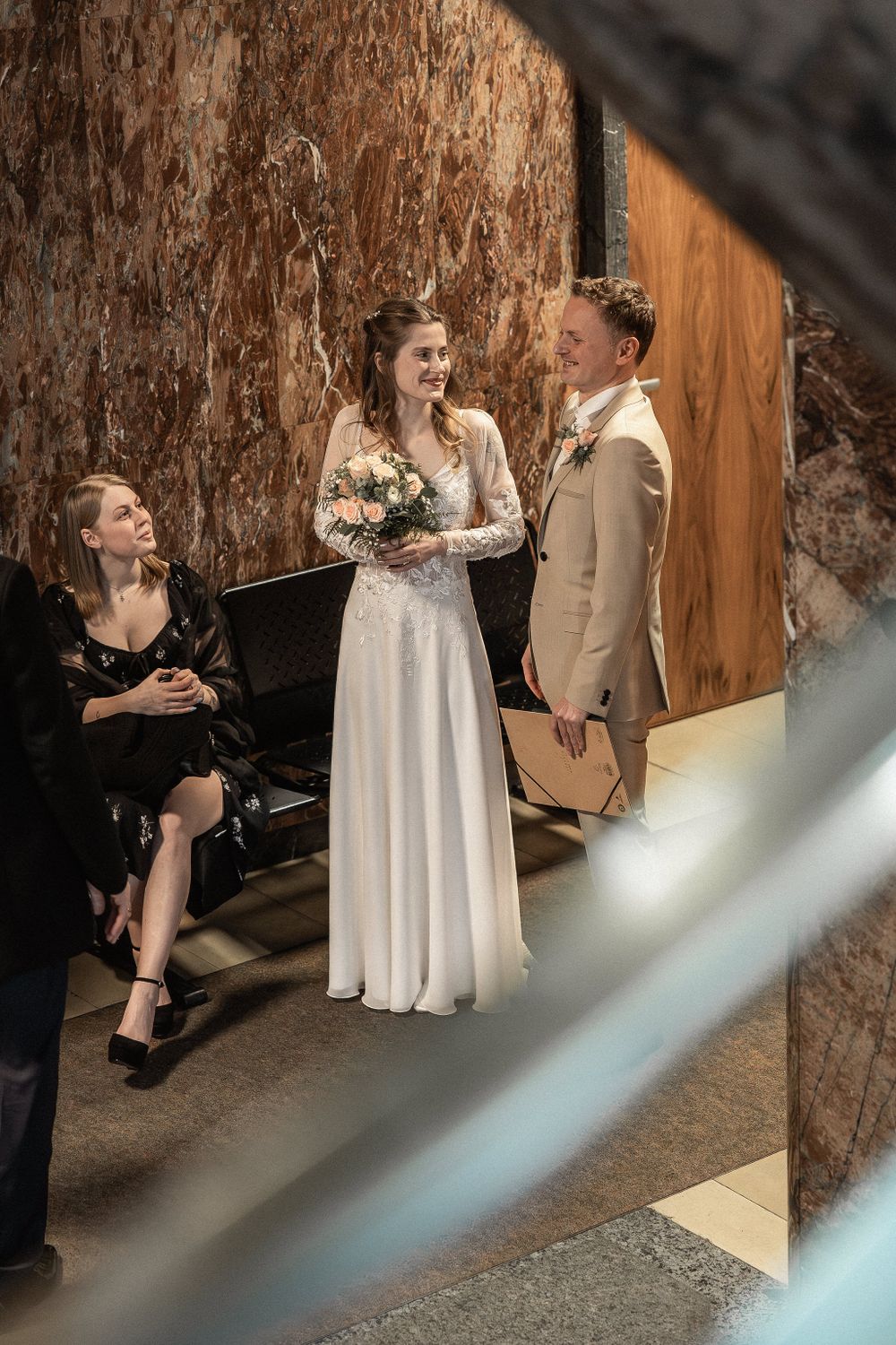 Wedding photo sequence in a rustic indoor setting with wooden wall textures.