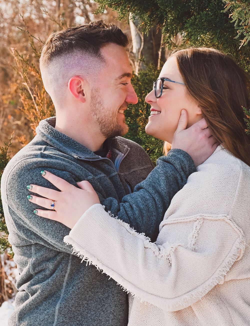 Engaged couple embracing at Fairfield Lakes in Lafayette, Indiana.