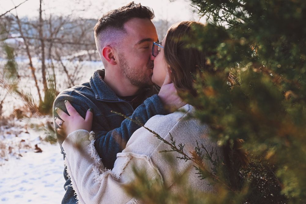 Engaged couple embracing at Fairfield Lakes in Lafayette, Indiana.