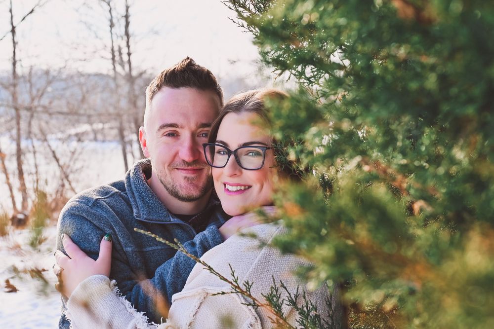 Engaged couple embracing at Fairfield Lakes in Lafayette, Indiana.