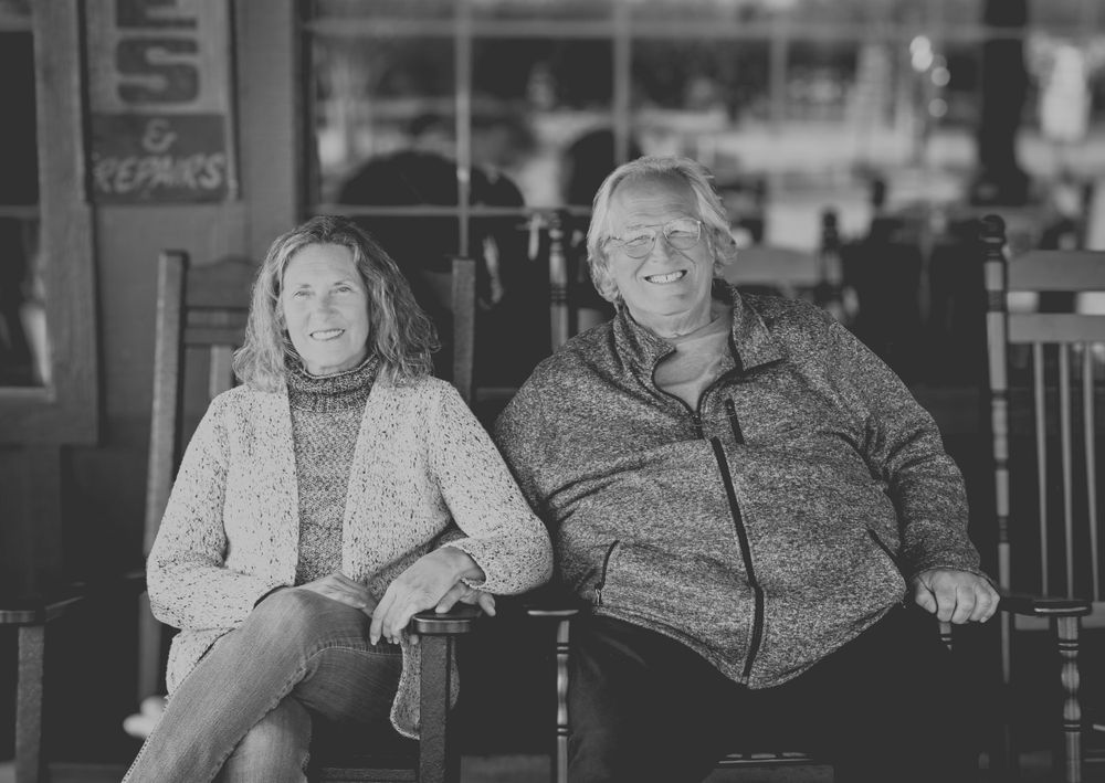 Couple sitting on rocking chairs at Cracker Barrel.