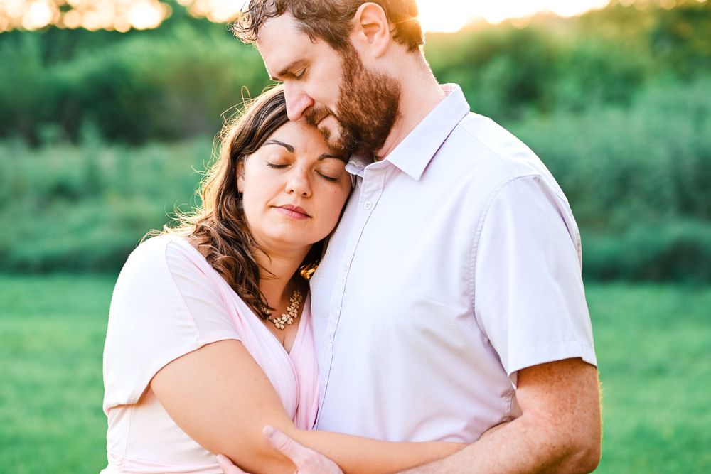 Husband & Wife embrace.