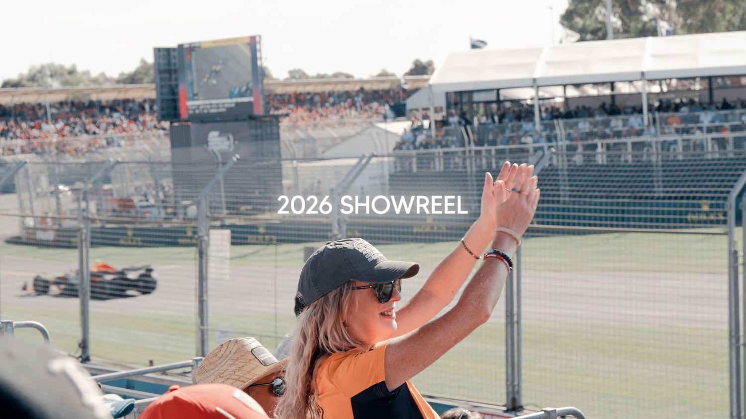 Photograph of young lady clapping at the Formula 1 in Melbourne