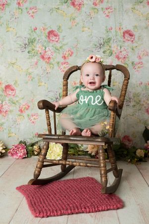 Series of photos showing a vintage wooden rocking chair with a pink knit rug against a floral wallpaper backdrop.