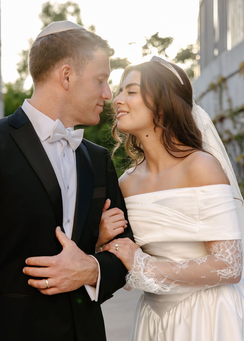 A romantic wedding photoshoot sequence showing a couple sharing intimate moments in formal attire.