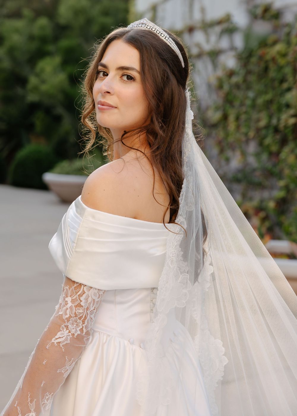 A sequence of bridal portraits showing a bride in an elegant off-shoulder wedding gown and veil.
