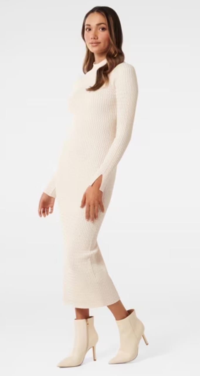 Fitted cream ribbed maxi dress with turtleneck shown in a fashion product shot.