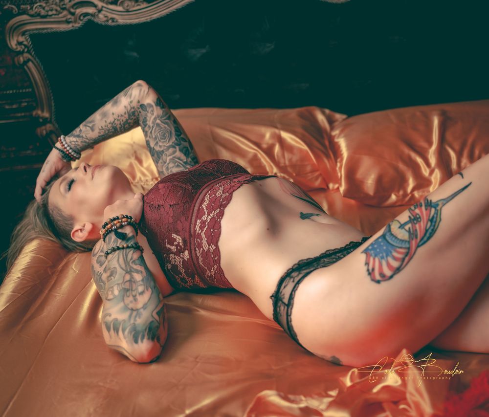 Woman laying in bed wearing lingerie