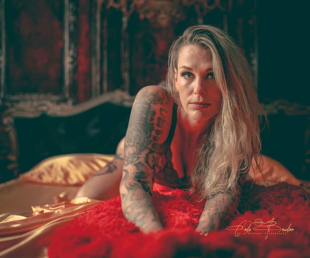 Woman laying in bed wearing lingerie