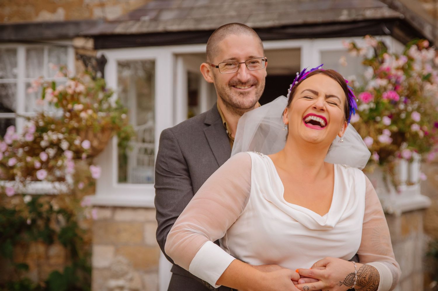 Bride laughing at Abbotsbury Wedding venue The Abbey House, Dorset. Documentary candid  Wedding Photographer, Dorset Somerset, Devon