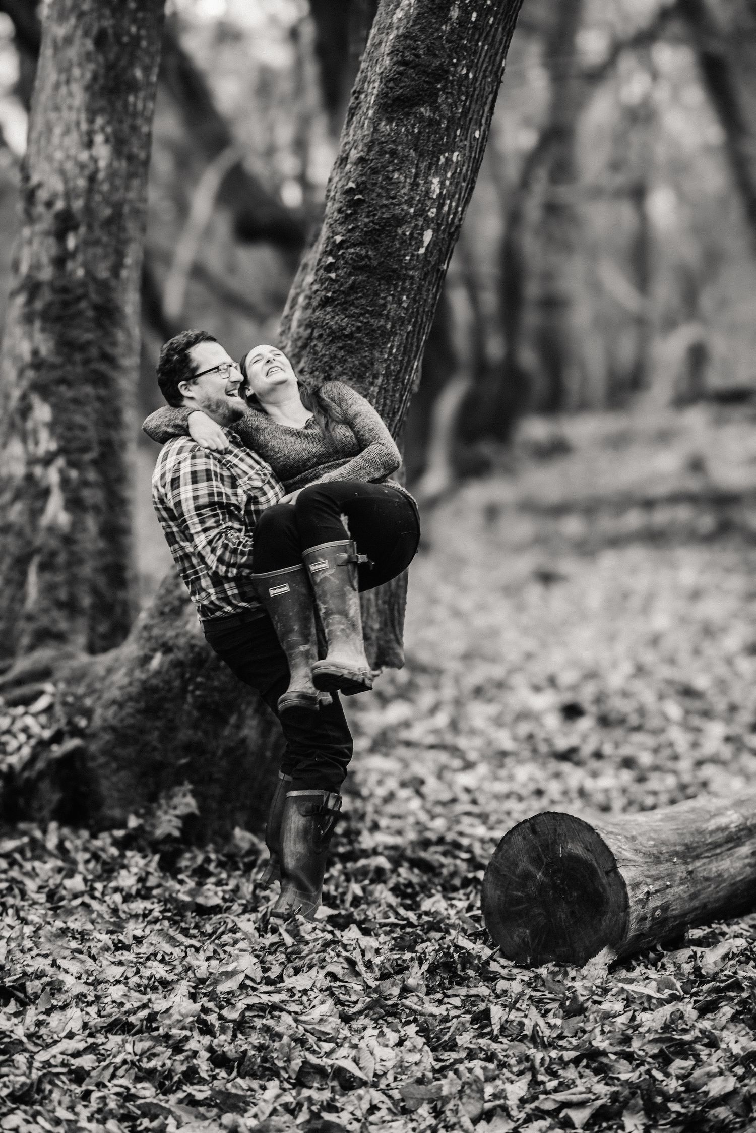 playful fun engagement photoshoot in Dorchester Dorset, in woods. Bluebells near Dorchester. Family photographer Dorchester