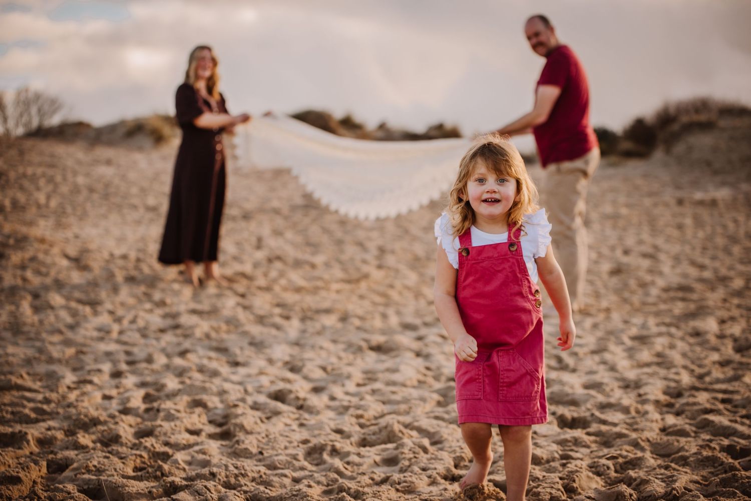 Family photography on the beach at Studland Dorset at golden hour.  Documentary family photography.