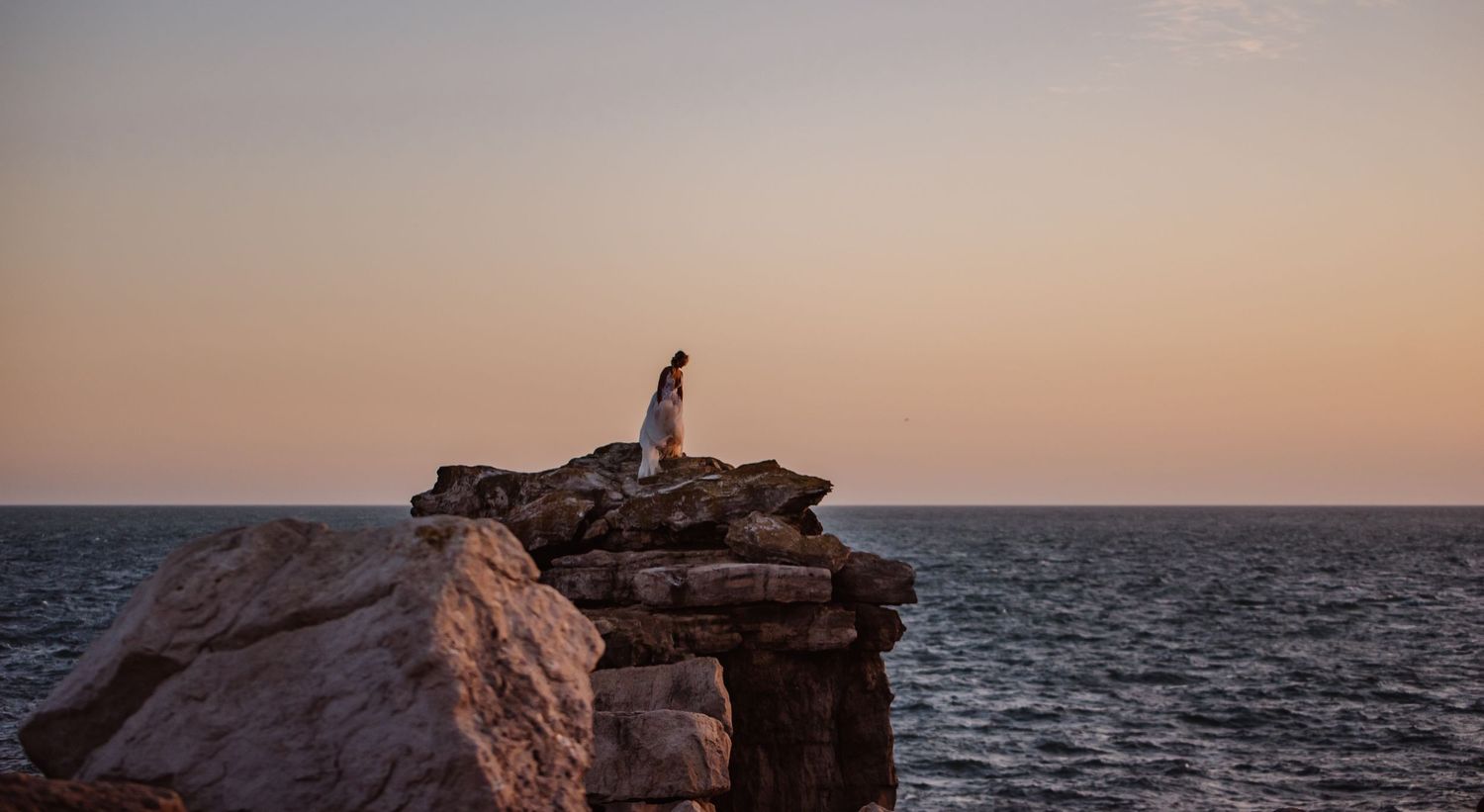 Portland wedding. Portland Bill. Bridal shoot Dorset. Rock climbing bride. Hunter wells. Weymouth Wedding photographer