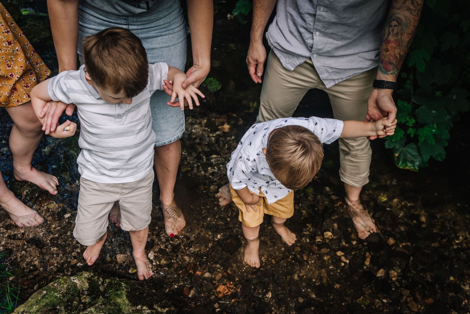 Family in the water at Little Bredy near Dorchester. Candid Family photographer Dorset, Somerset, Hampshire, Wiltshire