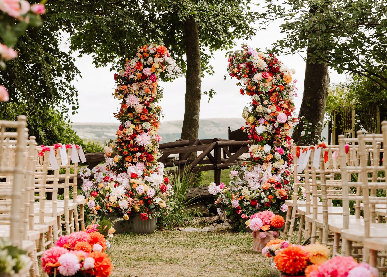 Bright artificial wedding floral display. Barn Wedding Venue Dorset - Kingston Country Courtyard Woodland wedding venue Dorset