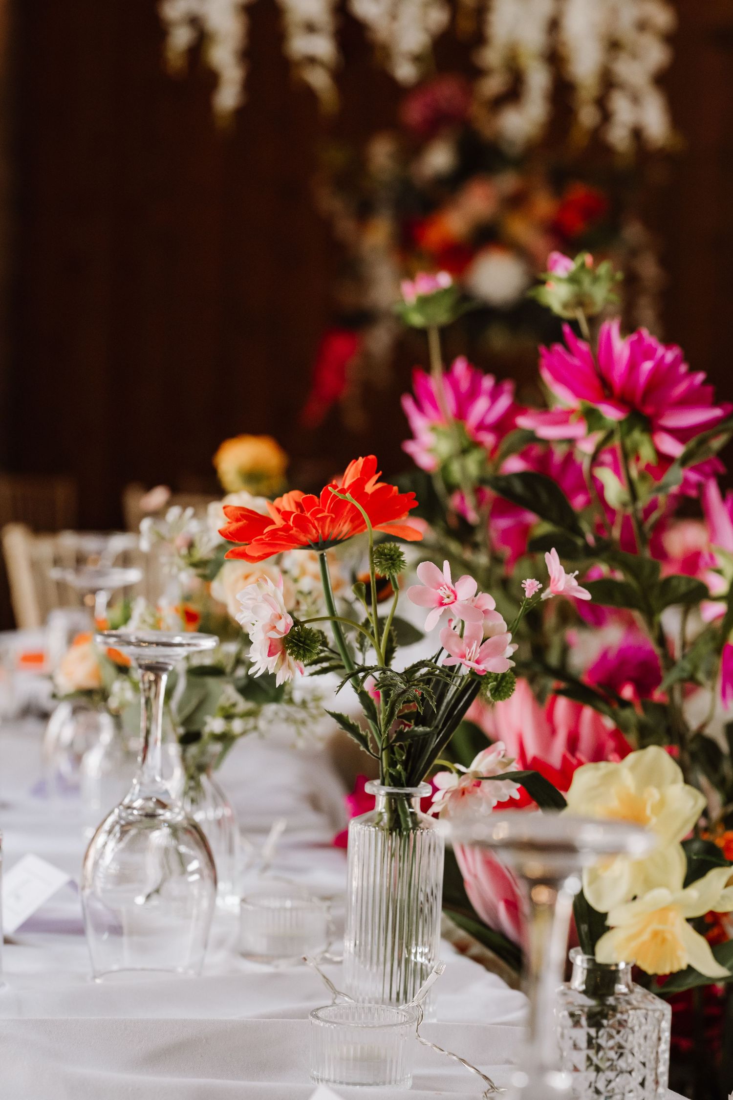 Bright artificial wedding floral display. Barn Wedding Venue Dorset - Kingston Country Courtyard Woodland wedding venue Dorset