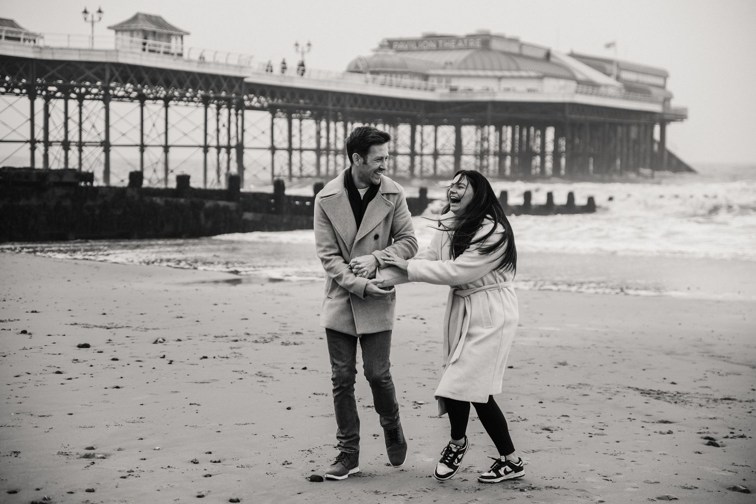 Beach couple engagement photography photo shoot, candid, fun, Dorset, Somerset, Hampshire, Devon. Dorset Photographer. Beach photographer.