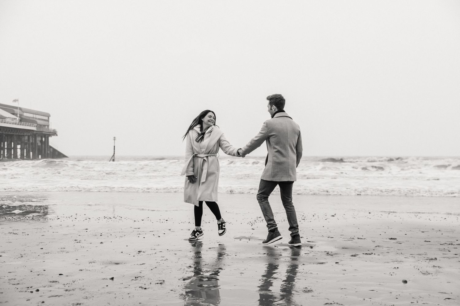 Beach couple engagement photography photo shoot, candid, fun, Dorset, Somerset, Hampshire, Devon. Dorset Photographer. Beach photographer.