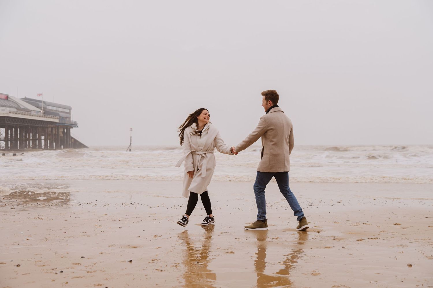 Beach couple engagement photography photo shoot, candid, fun, Dorset, Somerset, Hampshire, Devon. Dorset Photographer. Beach photographer.