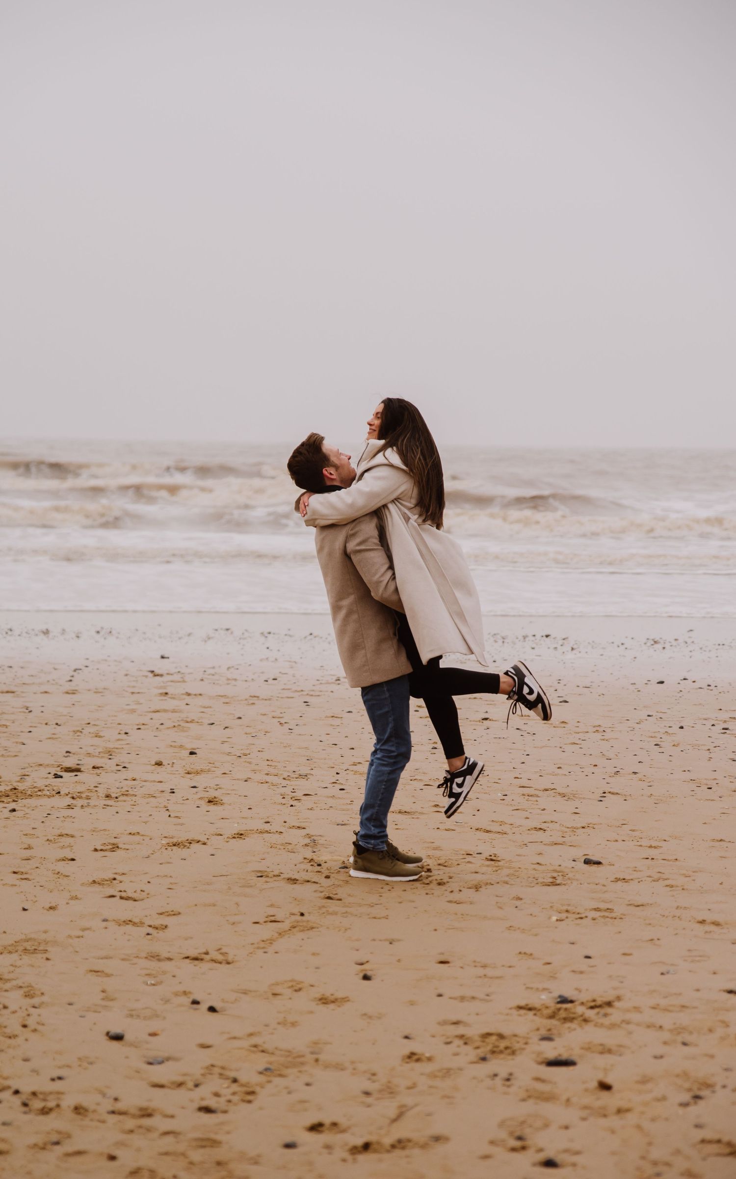 Beach couple engagement photography photo shoot, candid, fun, Dorset, Somerset, Hampshire, Devon. Dorset Photographer. Beach photographer.