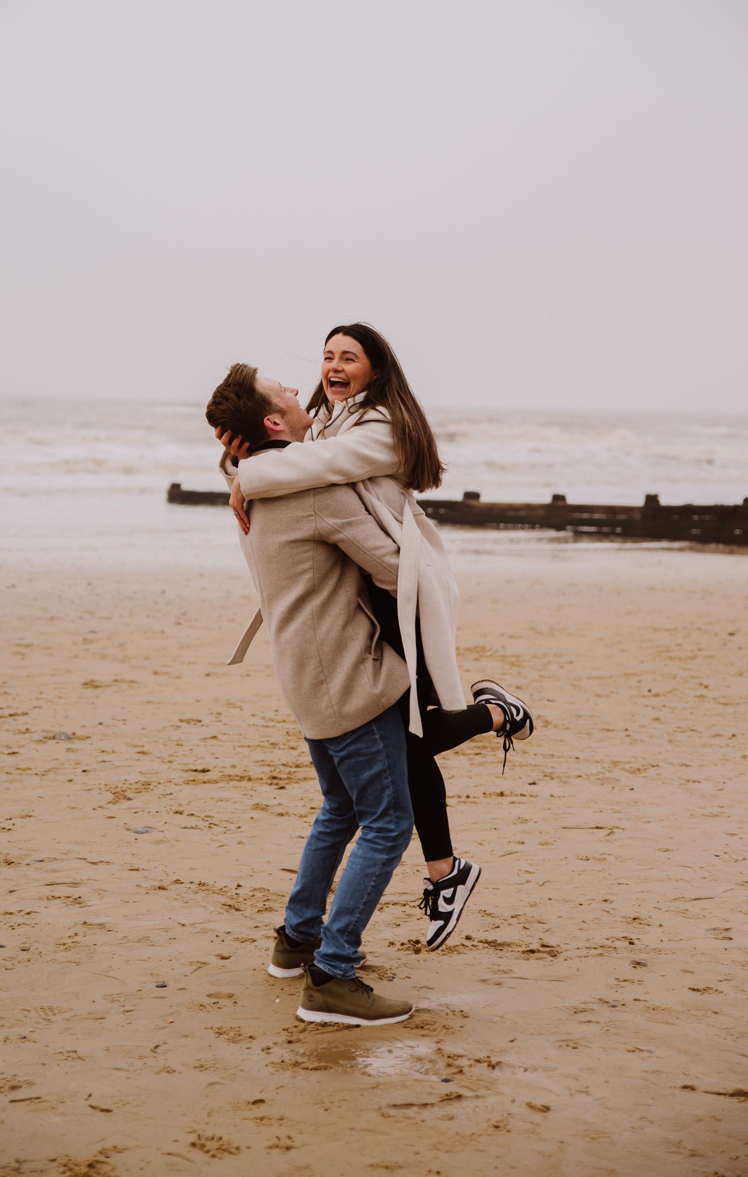 Beach couple engagement photography photo shoot, candid, fun, Dorset, Somerset, Hampshire, Devon. Dorset Photographer. Beach photographer.