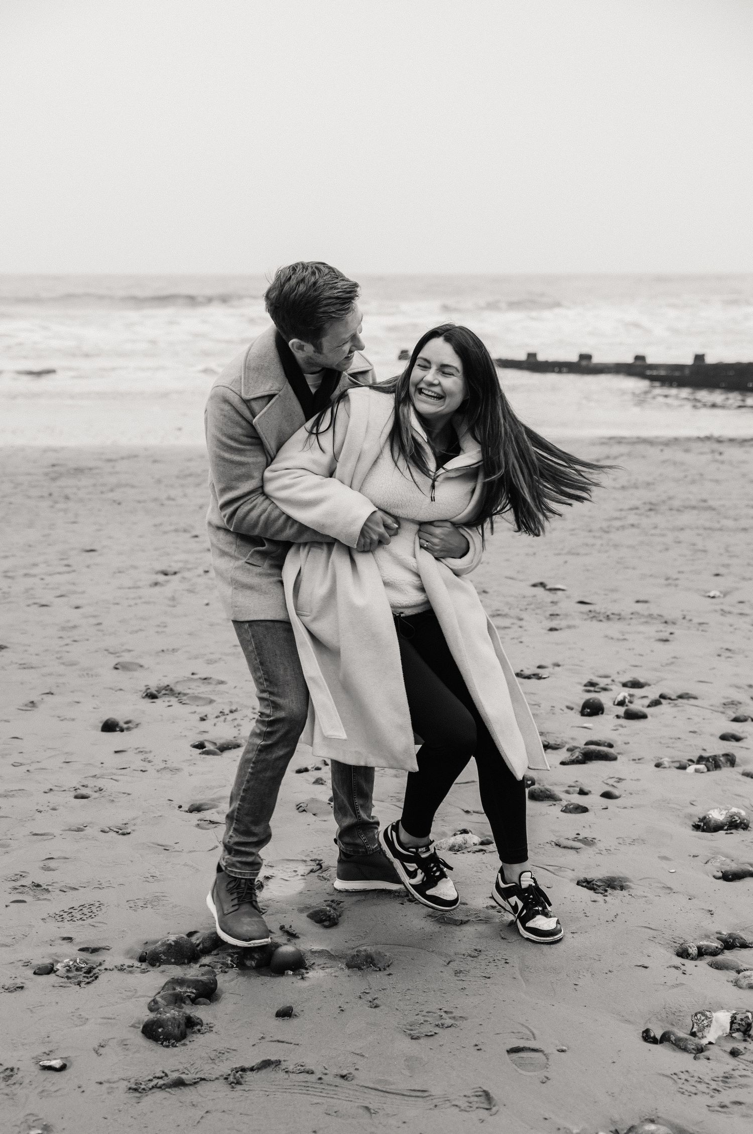 Beach couple engagement photography photo shoot, candid, fun, Dorset, Somerset, Hampshire, Devon. Dorset Photographer. Beach photographer.