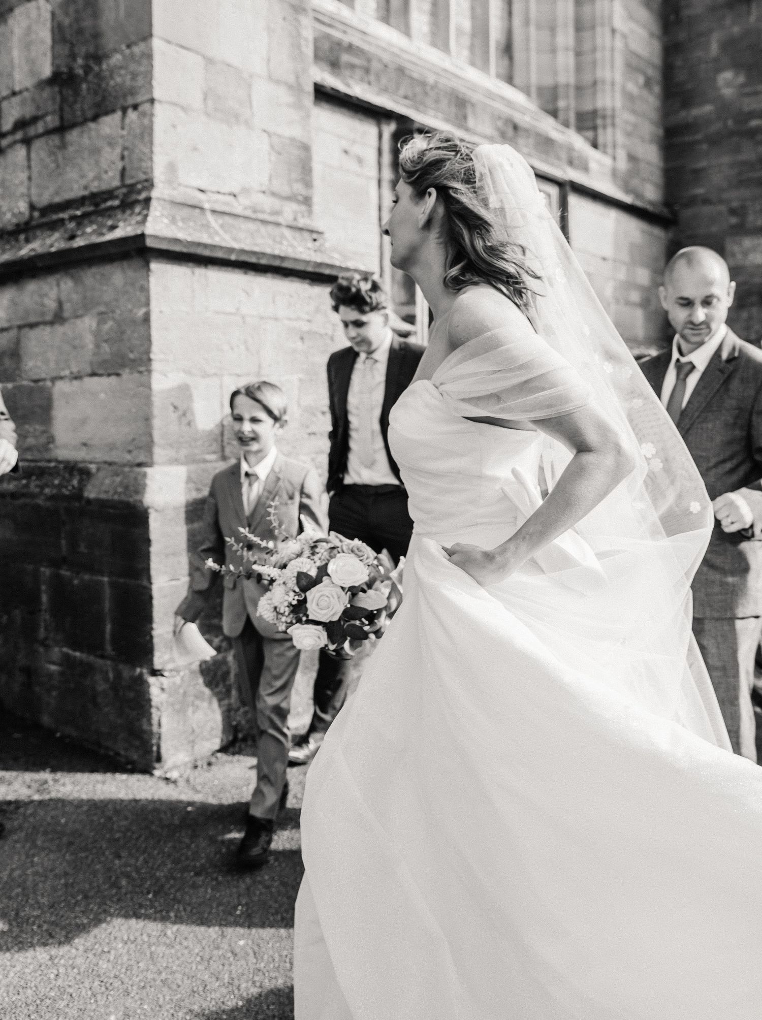 The Priory Church, Christchurch, Dorset wedding photography. Bride and Groom candid wedding photography. christchurch bridal