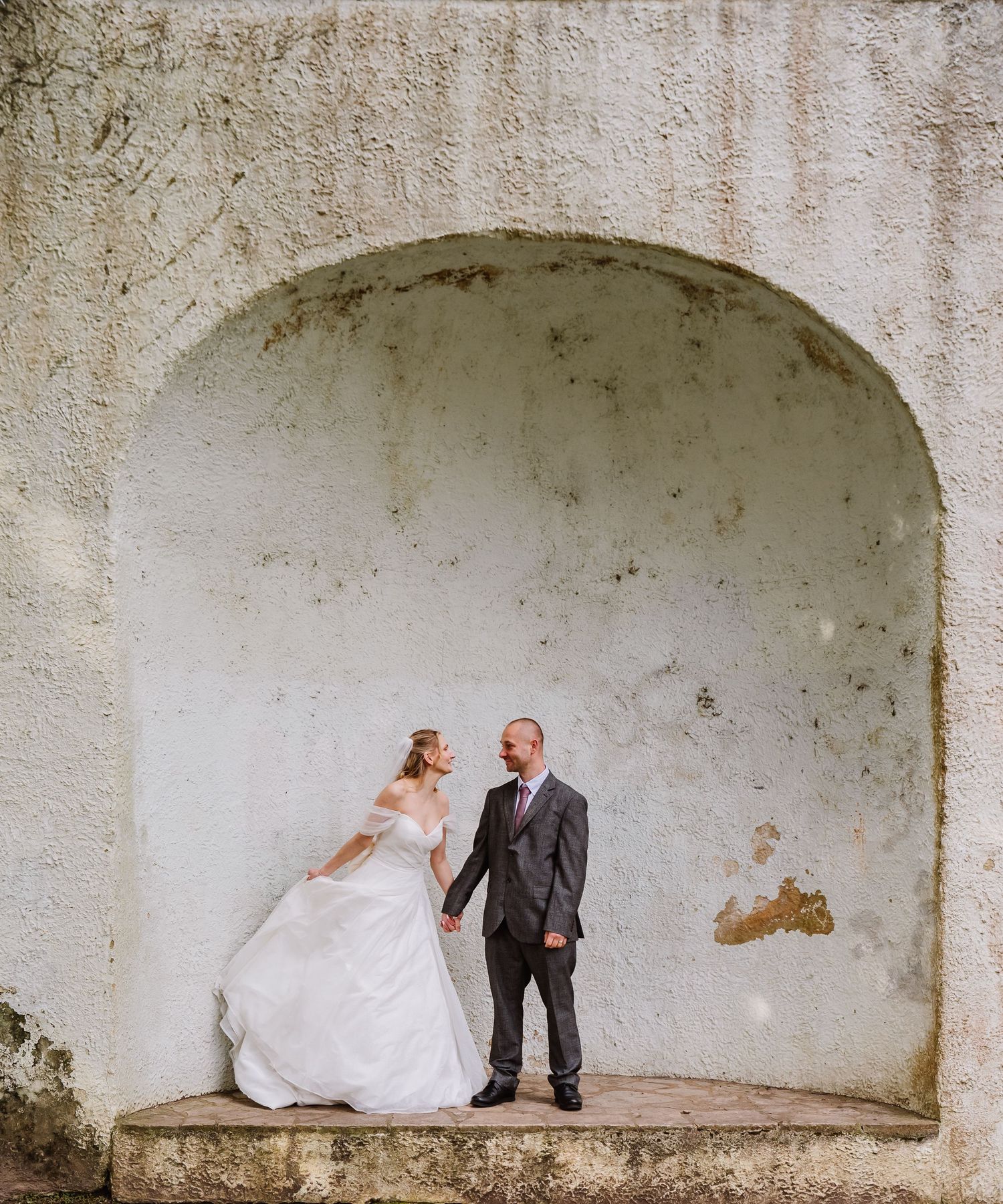 The Priory Church, Christchurch, Dorset wedding photography. Bride and Groom candid wedding photography. christchurch bridal