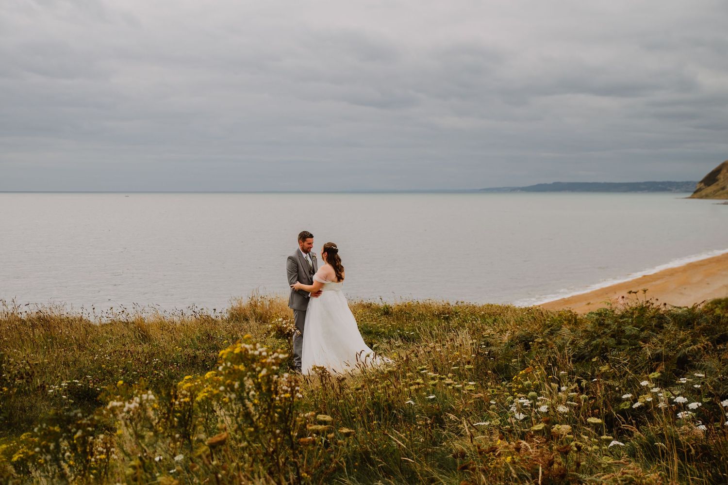Bridport wedding photography on the beach and cliffs Dorset. Bridport wedding photographer. Bridport wedding venue. Bridport wedding.