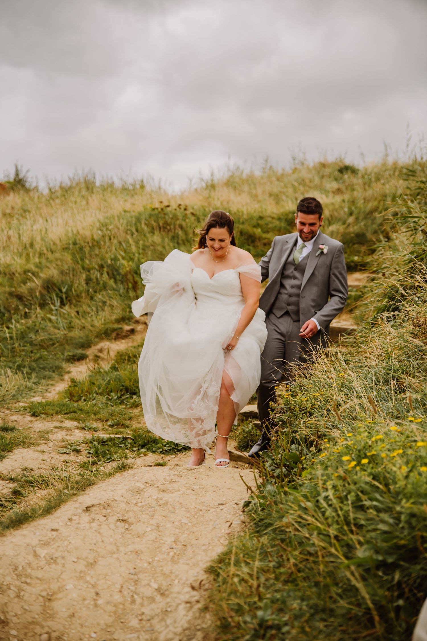 Bride and Groom at Eype near Bridport. Wedding couple photos on beach.  Documentary candid  Wedding Photography, Dorset