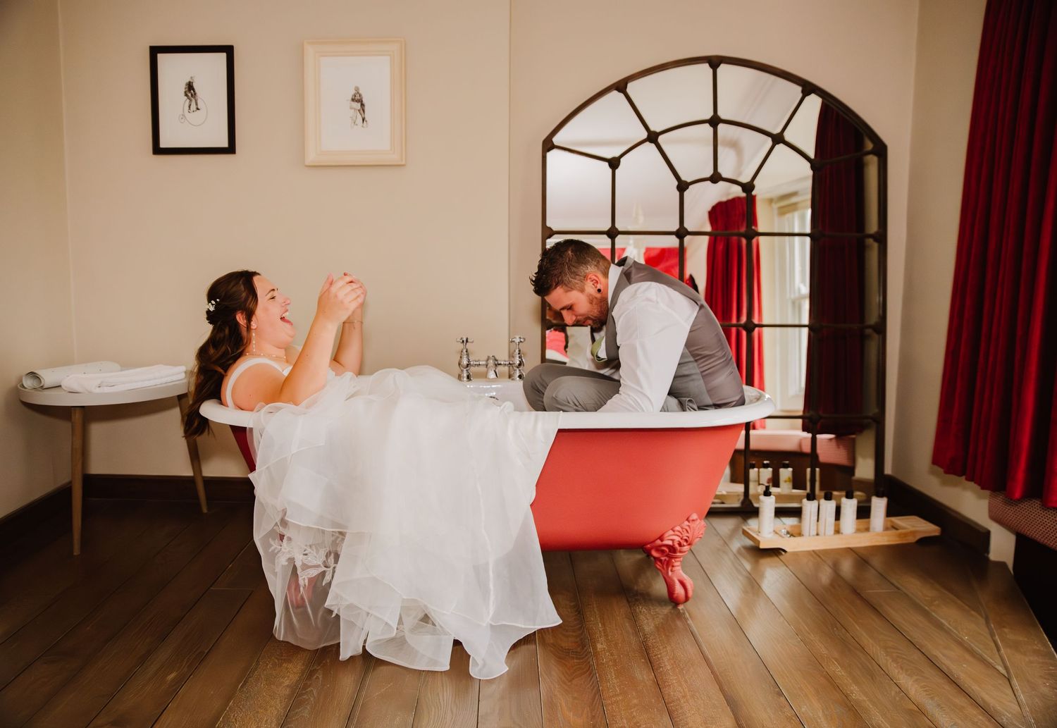 The Bull Hotel Bridport, Dorset. Bride and groom in a bath in the hotel room . Wedding venue Bridport. Bridport Wedding photographer.