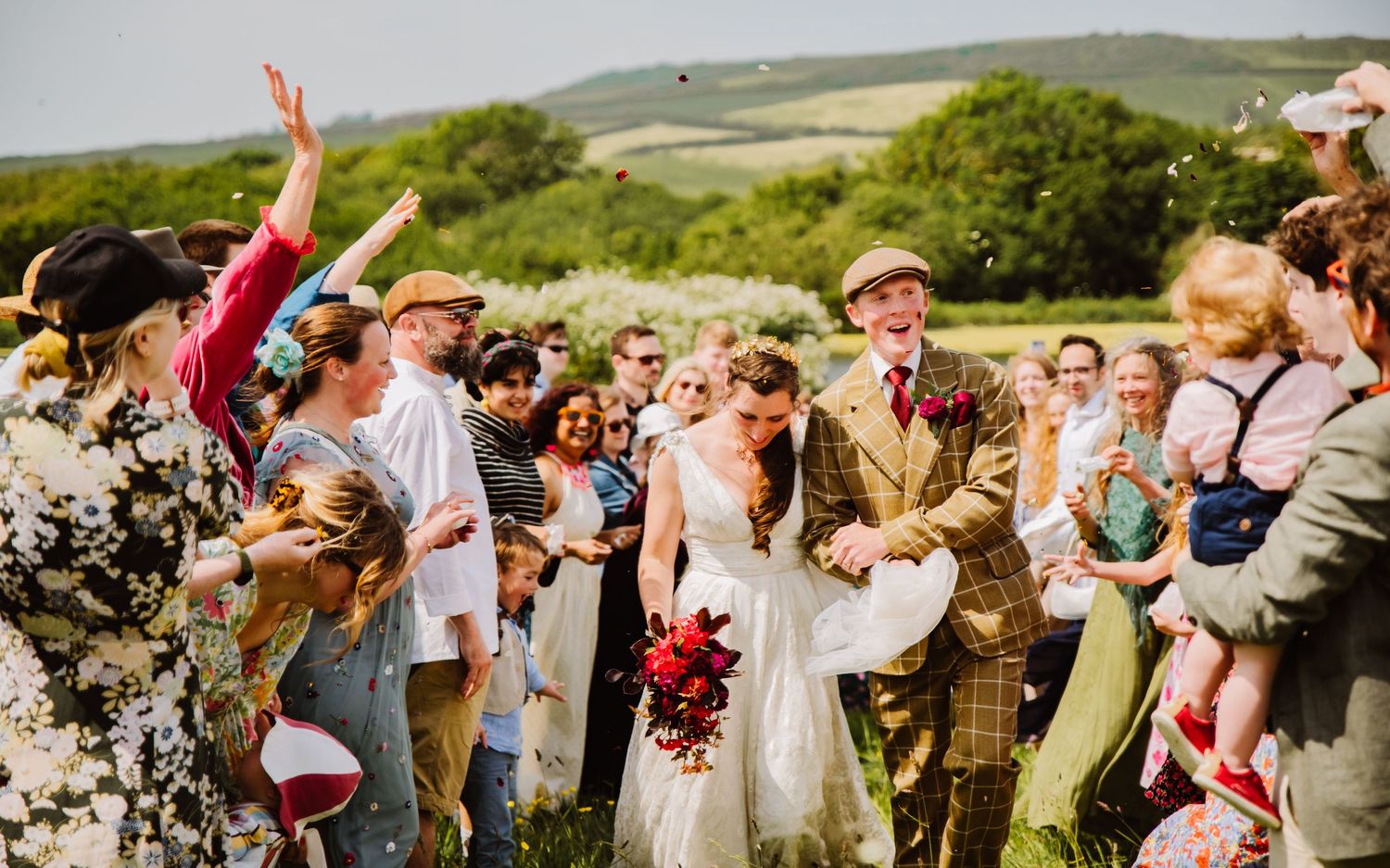 Bright and colourful wedding photography confetti shot. Outdoor wedding venue near Abbotsbury, Bridport, Weymouth, Dorchester, Dorset