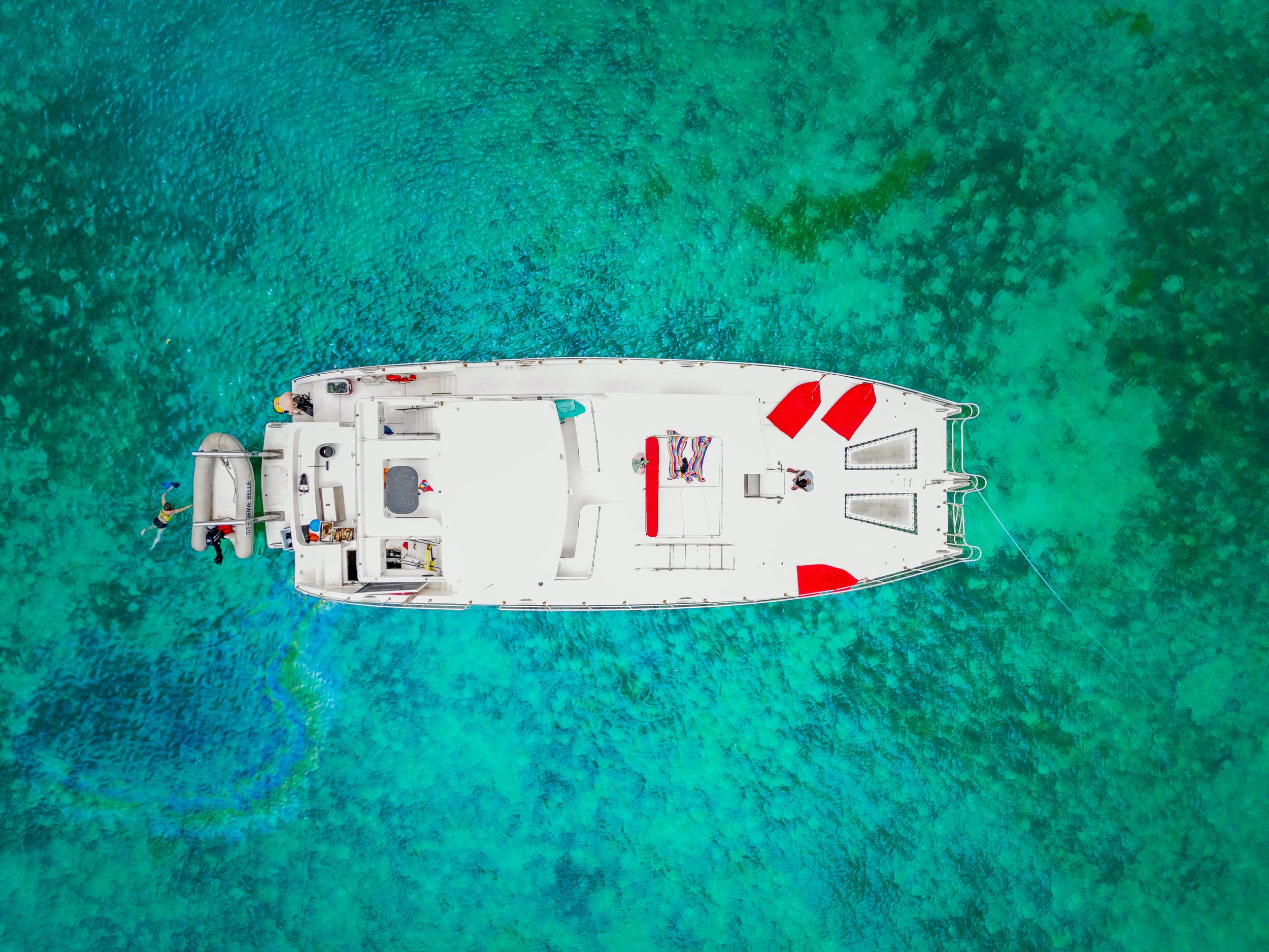 Aerial photo of luxury yacht in turquoise Caribbean waters — travel and lifestyle photography by Timoy B Photography.