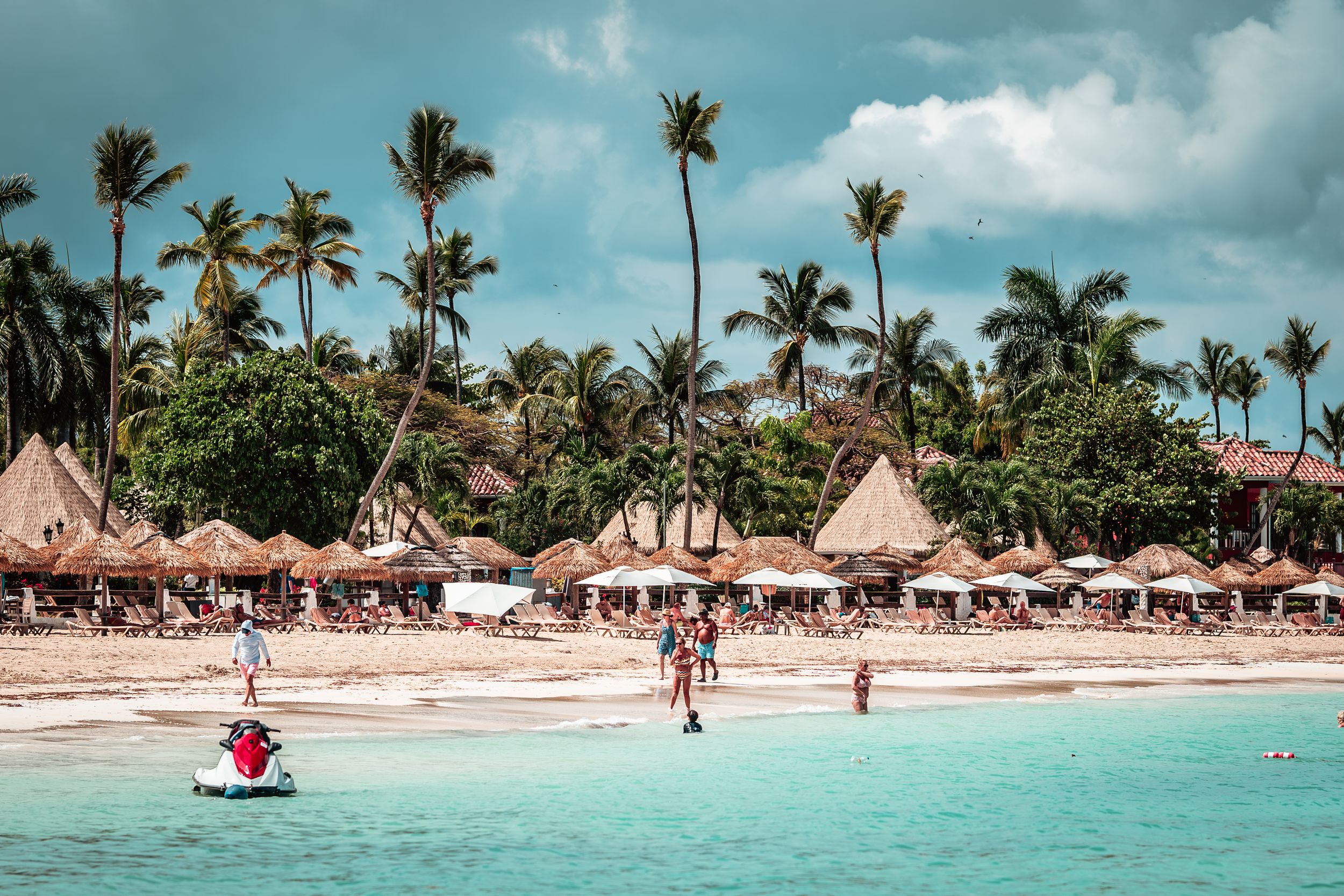 Beachfront resort view with palm trees — luxury travel photography by Timoy B Photography in Antigua.