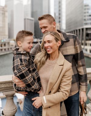 Happy family moment captured against urban backdrop of downtown Chicago.